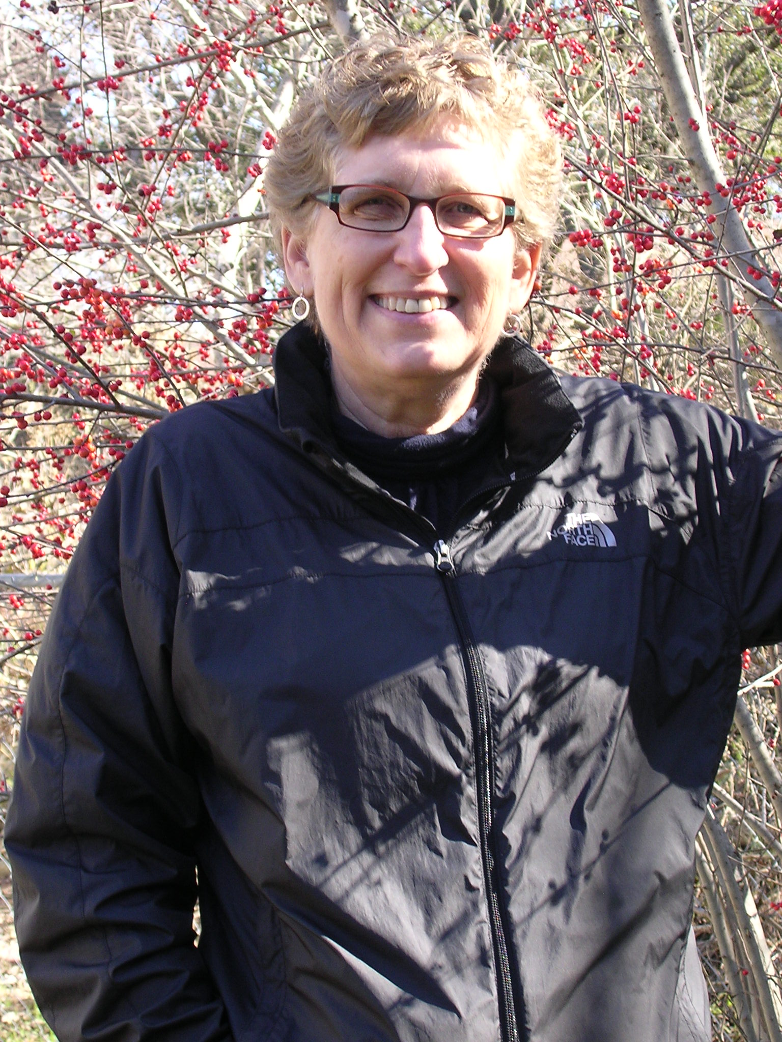 Norma Fowler in front of Ilex decidua