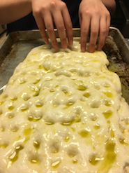 Angela O. pokes the dough