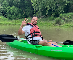 Alan E. S. C. kayaking on Bastrop River