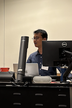 Image of Qiang Huang speaking