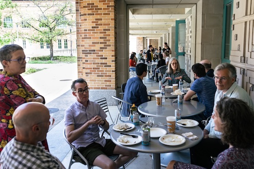 Photo of symposium attendees eating