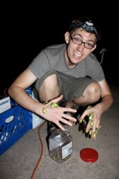 Vince M. with green beetles crawling on his hands
